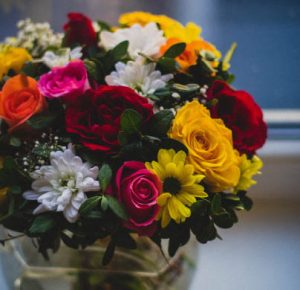 The easiest way to liven up your home is by adding a few fresh flowers. You can go to your local grocery store and buy $5 bouquets to place in vases around the house. It can add some holiday ambiance, and beautiful scents to your space. 