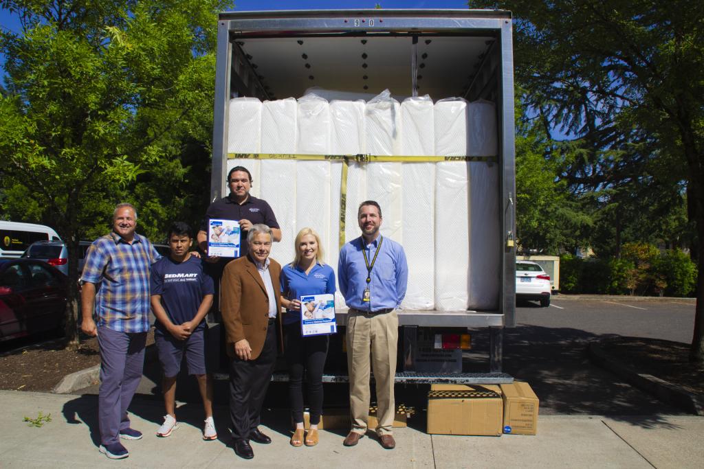 BedMart team smiles with Tempur-Pedic and Portland Mission staff